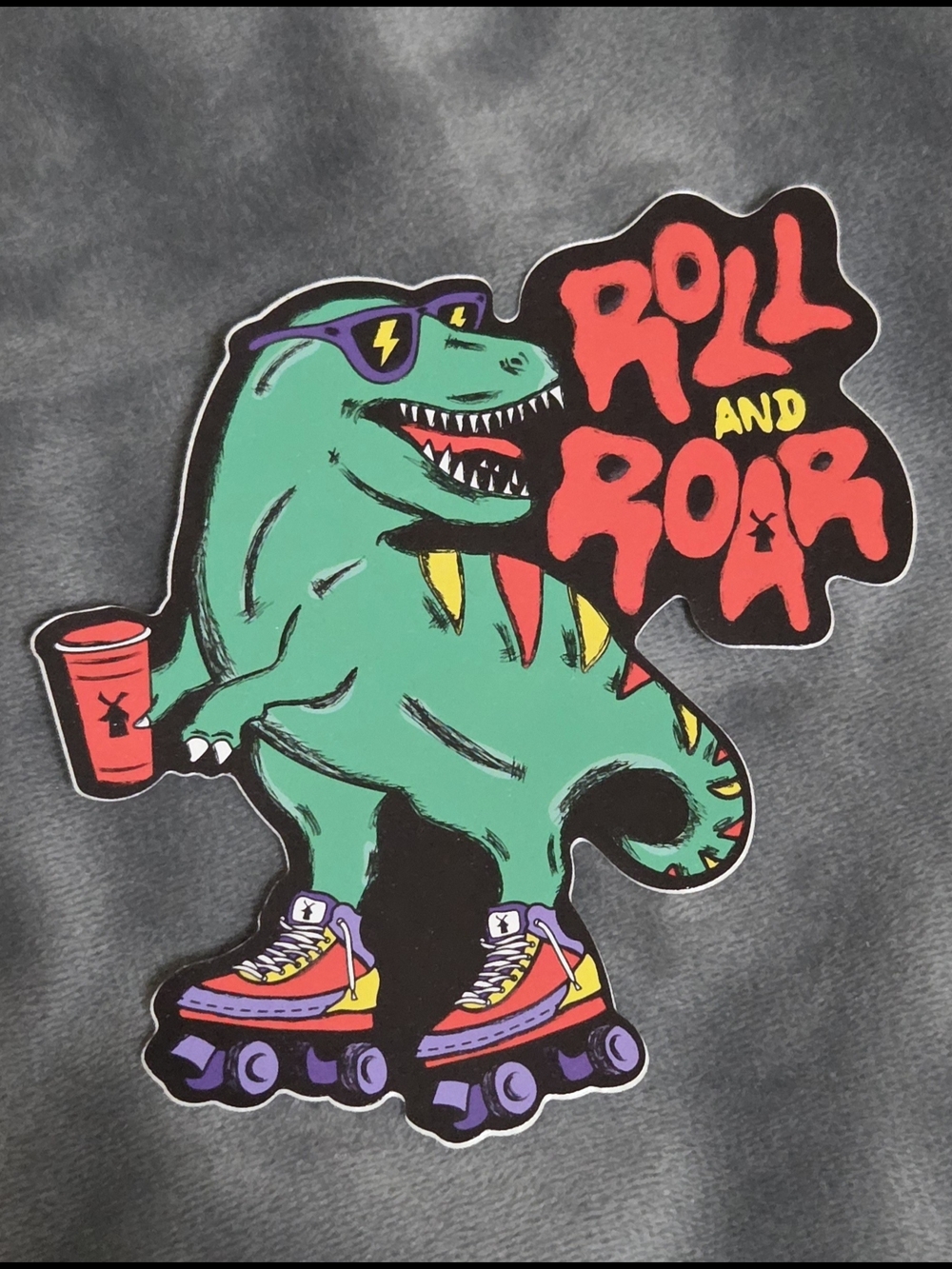 Dutch Bros Green Dinosaur "Roll and Roar" Sticker with Red Accents